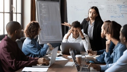 Red rubber lobster toy on blue background
