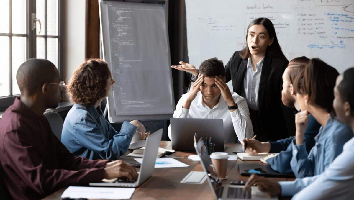 Red rubber lobster toy on blue background