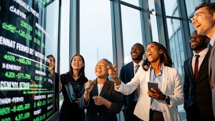 young man standing in front of the projection reflected stock market