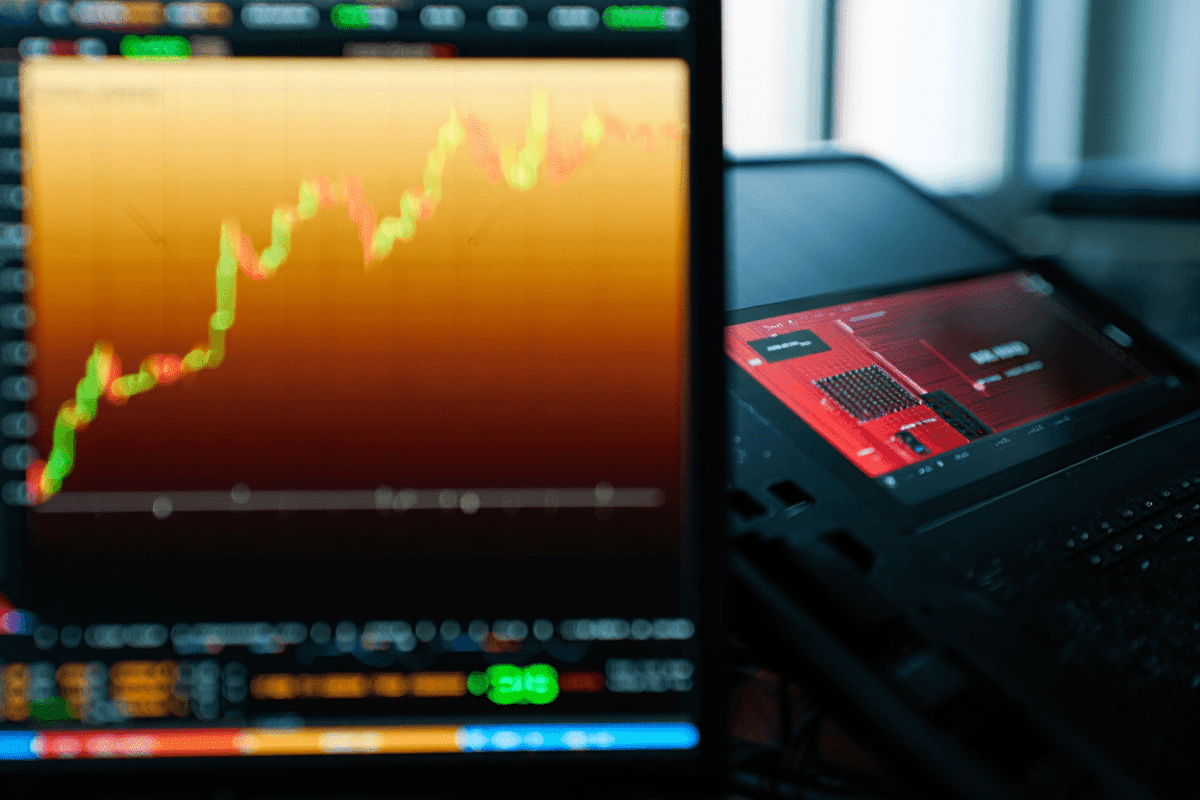Stock market closes with Dow at record high, Nasdaq falls on chip selloff