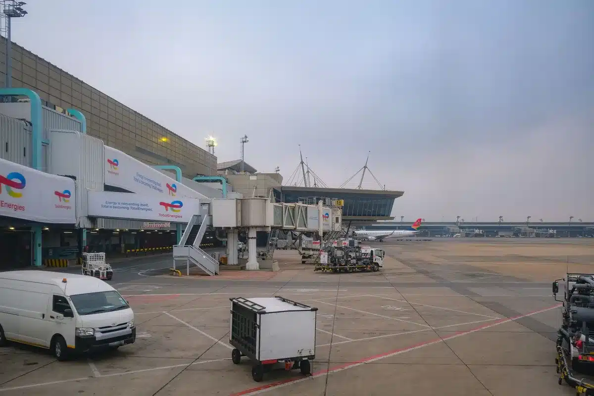 An aircraft parked at a gate with fuel trucks nearby, showing the intersection of revenue growth and rising operational costs