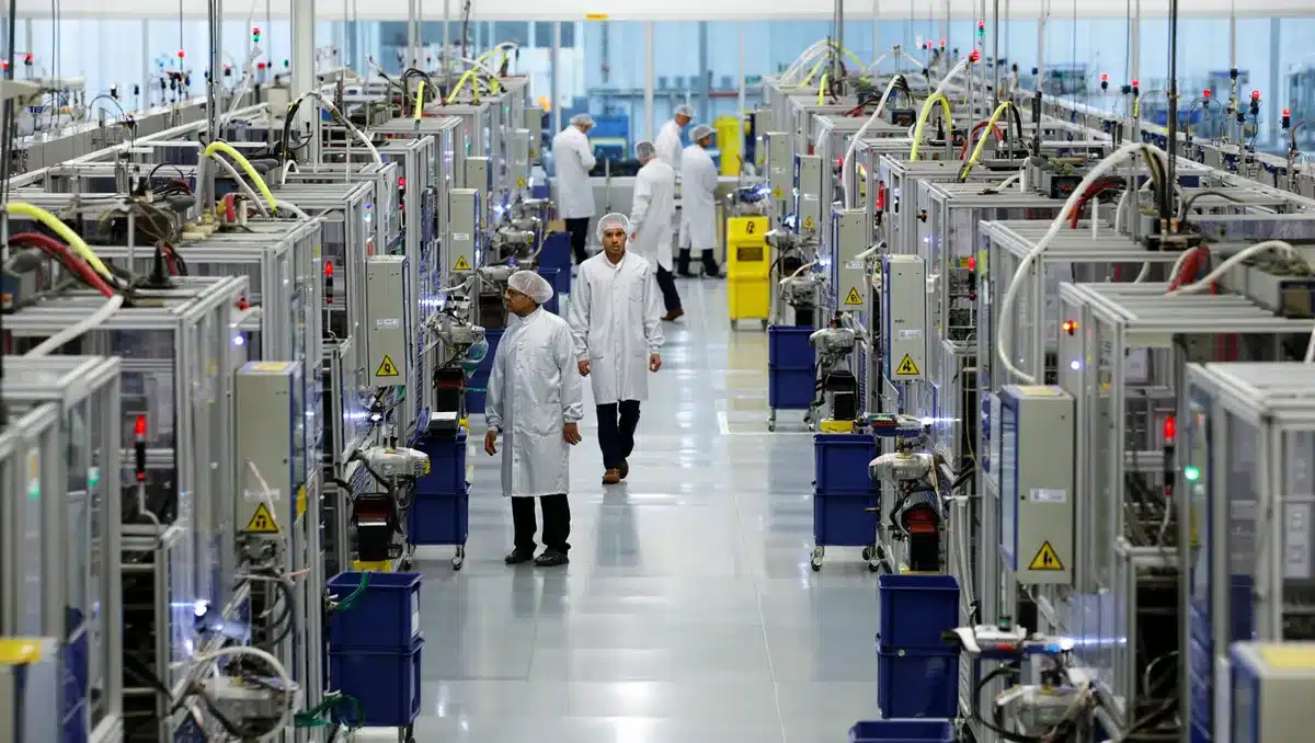 A manufacturing facility floor with semiconductor processing equipment and clean room setup | semiconductor manufacturing facility
