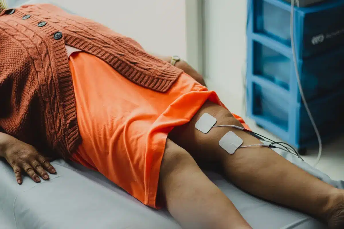 A rehabilitation center interior with therapy equipment visible, patient recovery in progress, medical care setting