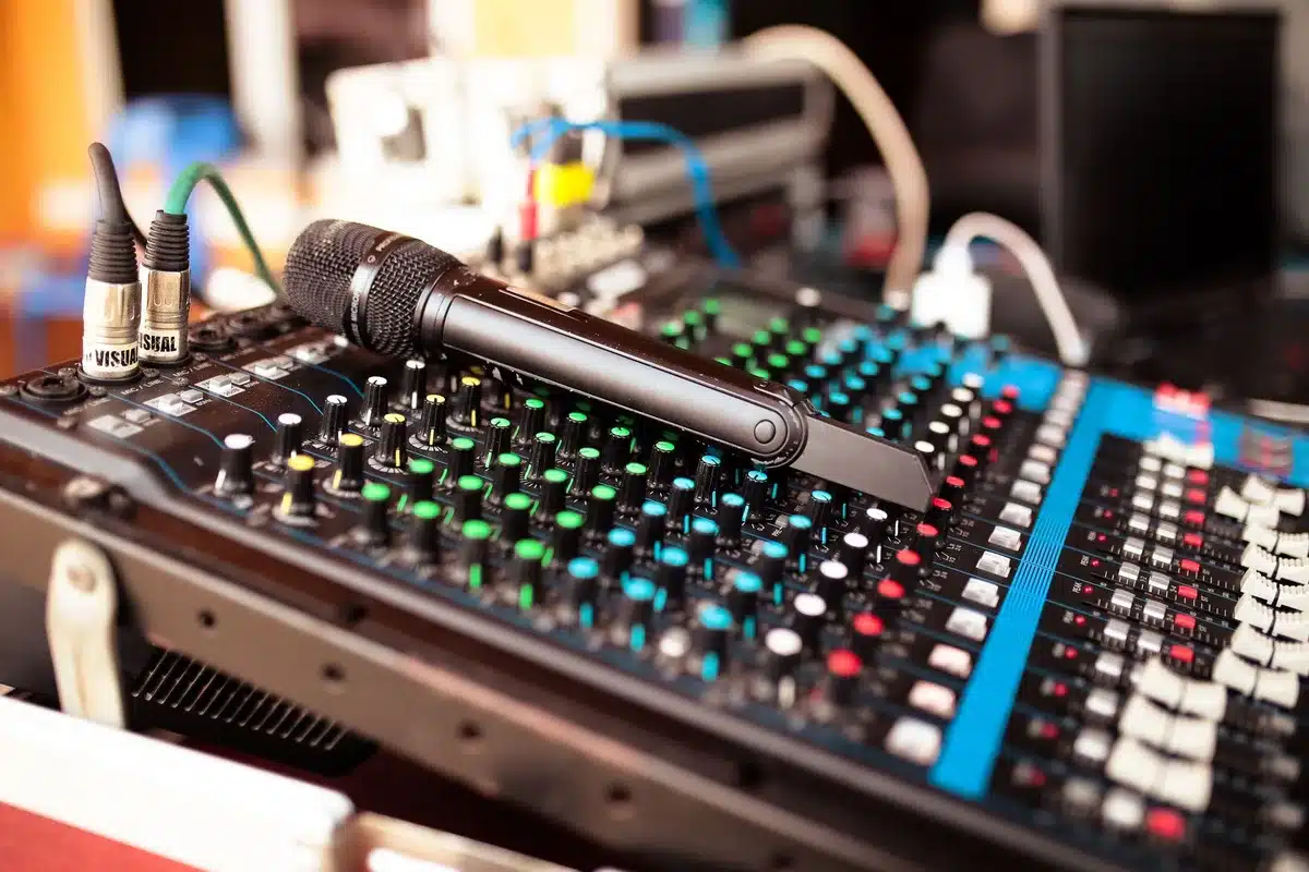 Audio recording equipment and microphone in a professional studio setting, representing the 70 hours of captured interviews