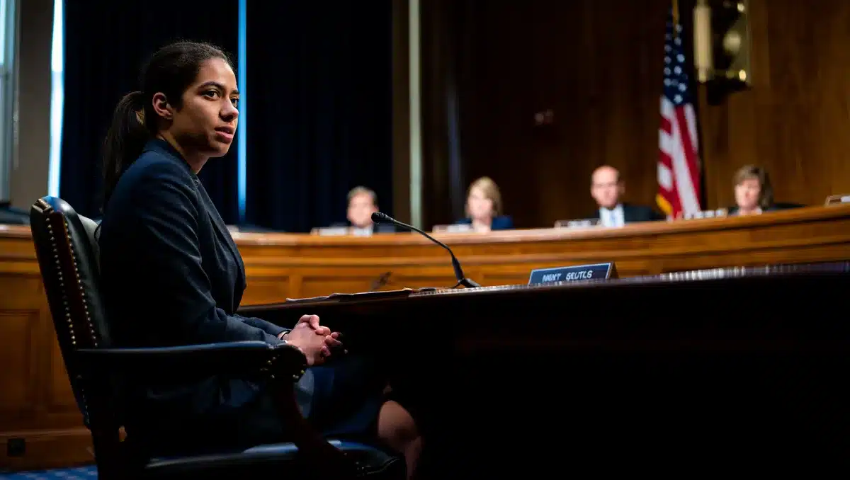 A formal government office setting with a witness chair facing a panel of senators in a hearing room | senate hearing room