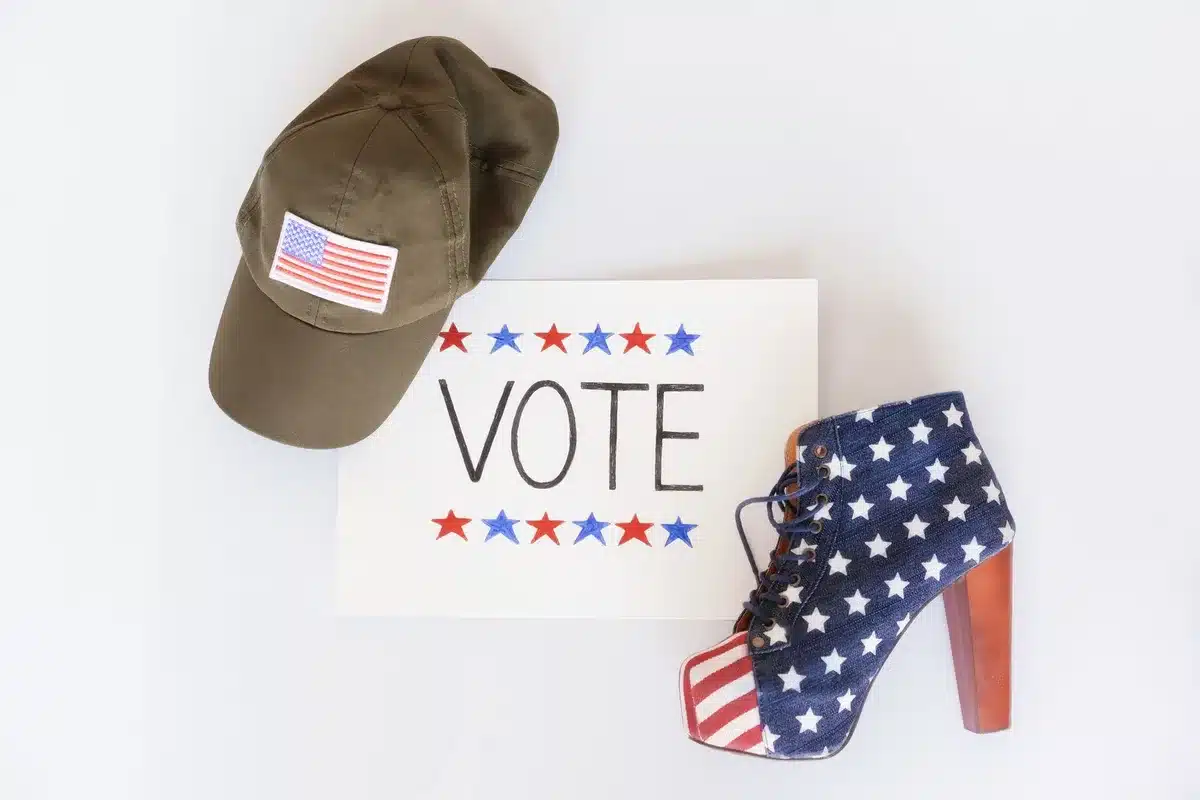 A packed primary election venue with anonymous voters and campaign signage visible, showing the competitive nature of South Carolina's Republican primary process.