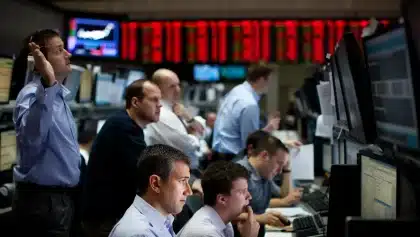 Dow drops 1,153 points as Fed holds rates steady with hawkish tone