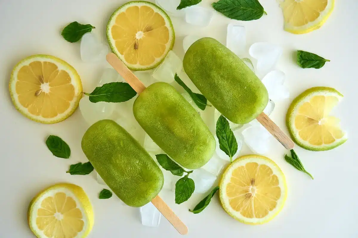 An FDA inspection notice and frozen popsicle products displayed on a white surface, emphasizing food safety documentation and frozen confections under scrutiny.