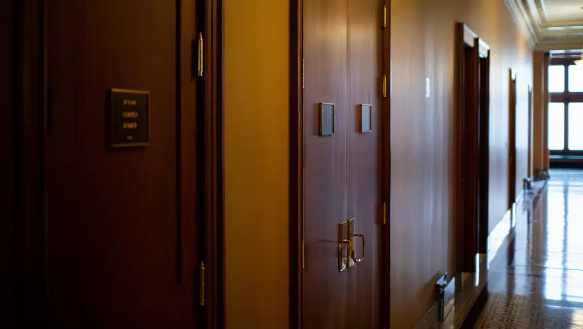 Capitol building hallway with office doors, formal interior architecture | congressional office building interior