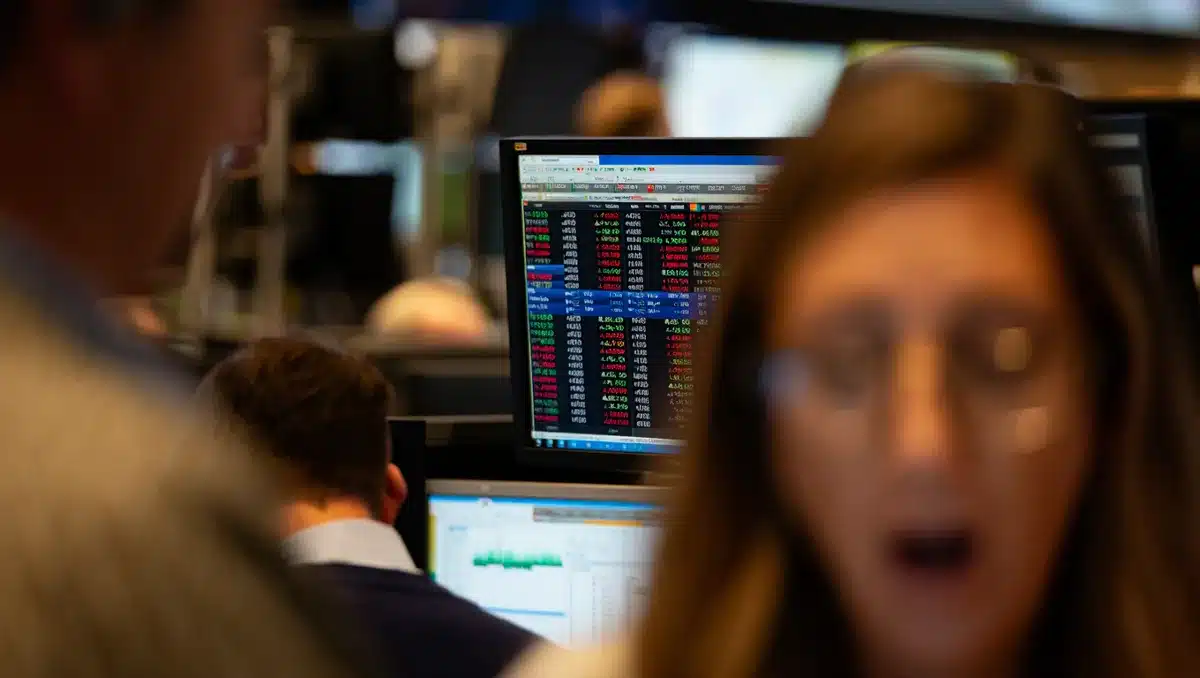 A stock market trading screen displaying semiconductor stock tickers and price movements, with red and green indicators reflecting market volatility, investor sentiment captured in real-time data | stock market ticker screen