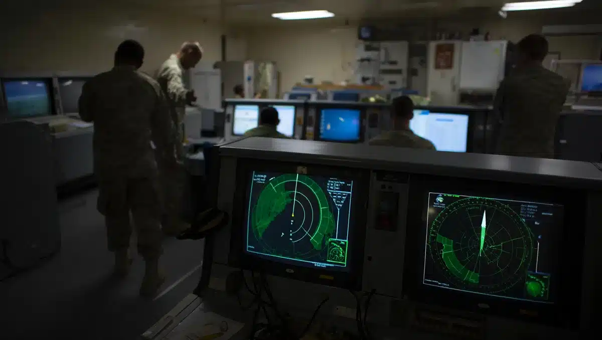 Radar screens and military command centers monitoring missile trajectories and air defense systems across the Persian Gulf region | military operations center