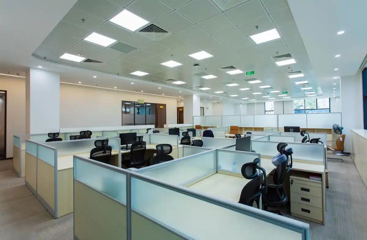A federal building with official seal, harsh overhead lighting, empty hallway, bureaucratic atmosphere