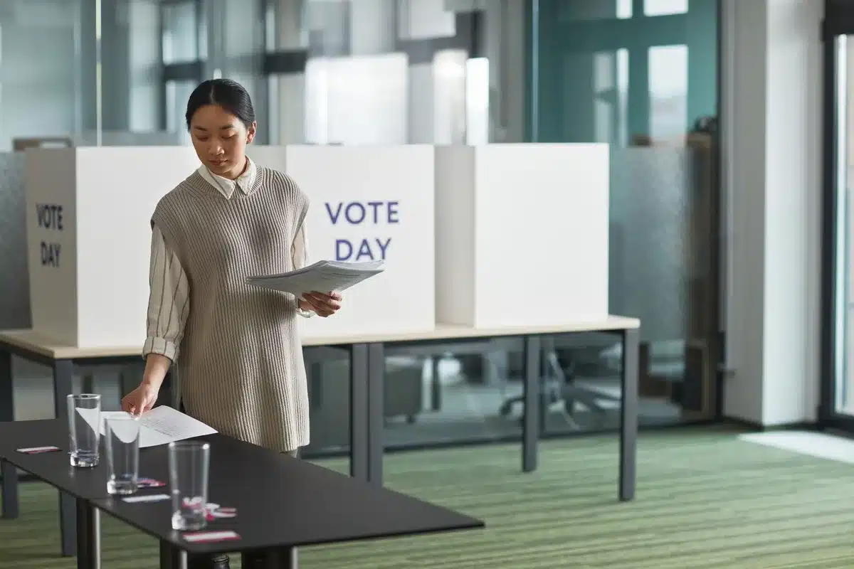 Government office interior with voter registration documents and identification materials scattered on desk