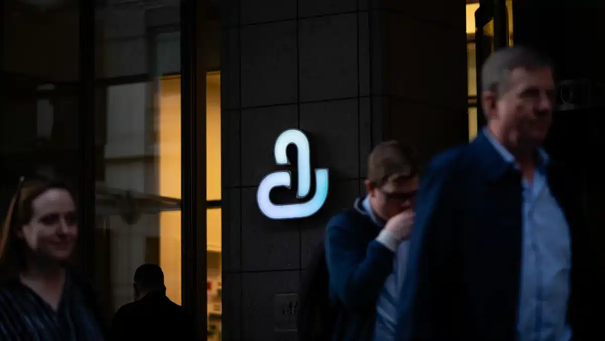 A glowing pharmaceutical company logo on a modern office building facade at dusk, suggesting corporate accountability and market scrutiny | pharma building corporate