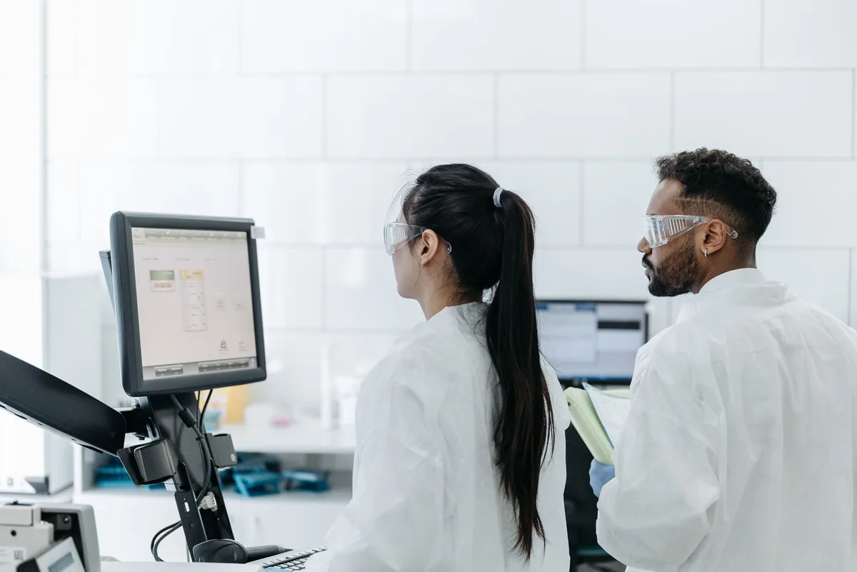 An empty, modern research lab with quantum computing equipment benches and collaborative workspace, symbolizing the innovation ecosystem The Bloch will create.