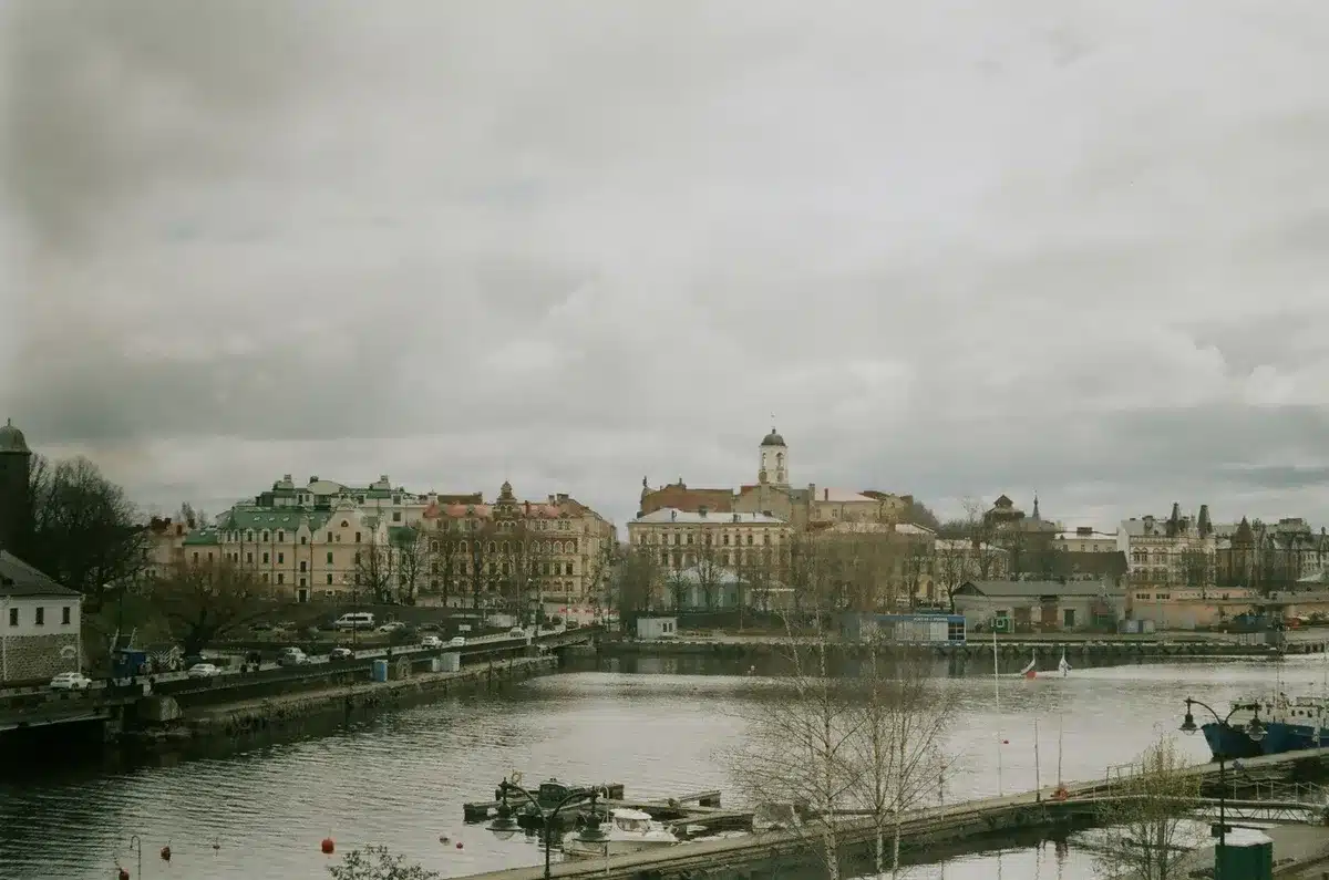 St. Petersburg harbor with military vessels moored, early morning light, calm water, no people visible