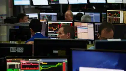 QQQ gains as Fed holds rates steady, three officials dissent