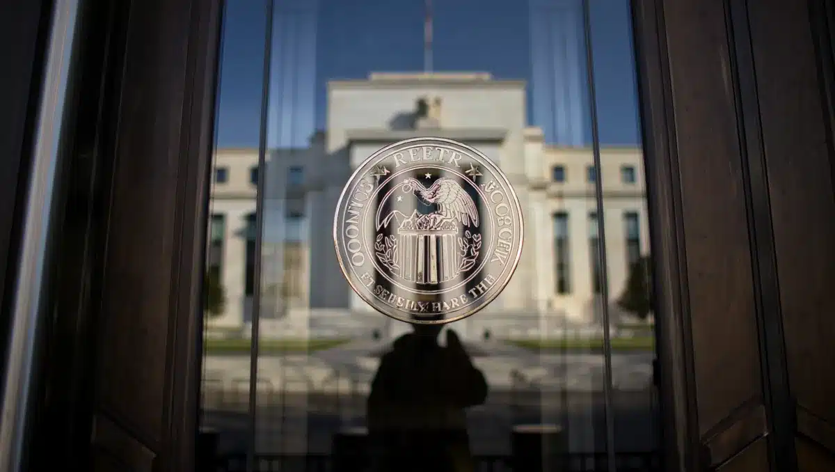Federal Reserve building with glass and steel architecture, official seal visible on entrance, formal institutional setting | Federal Reserve building exterior