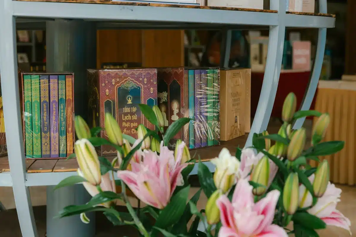 Book cover for "Communion" displayed in bookstore window with soft-focus interior, warm ambient lighting