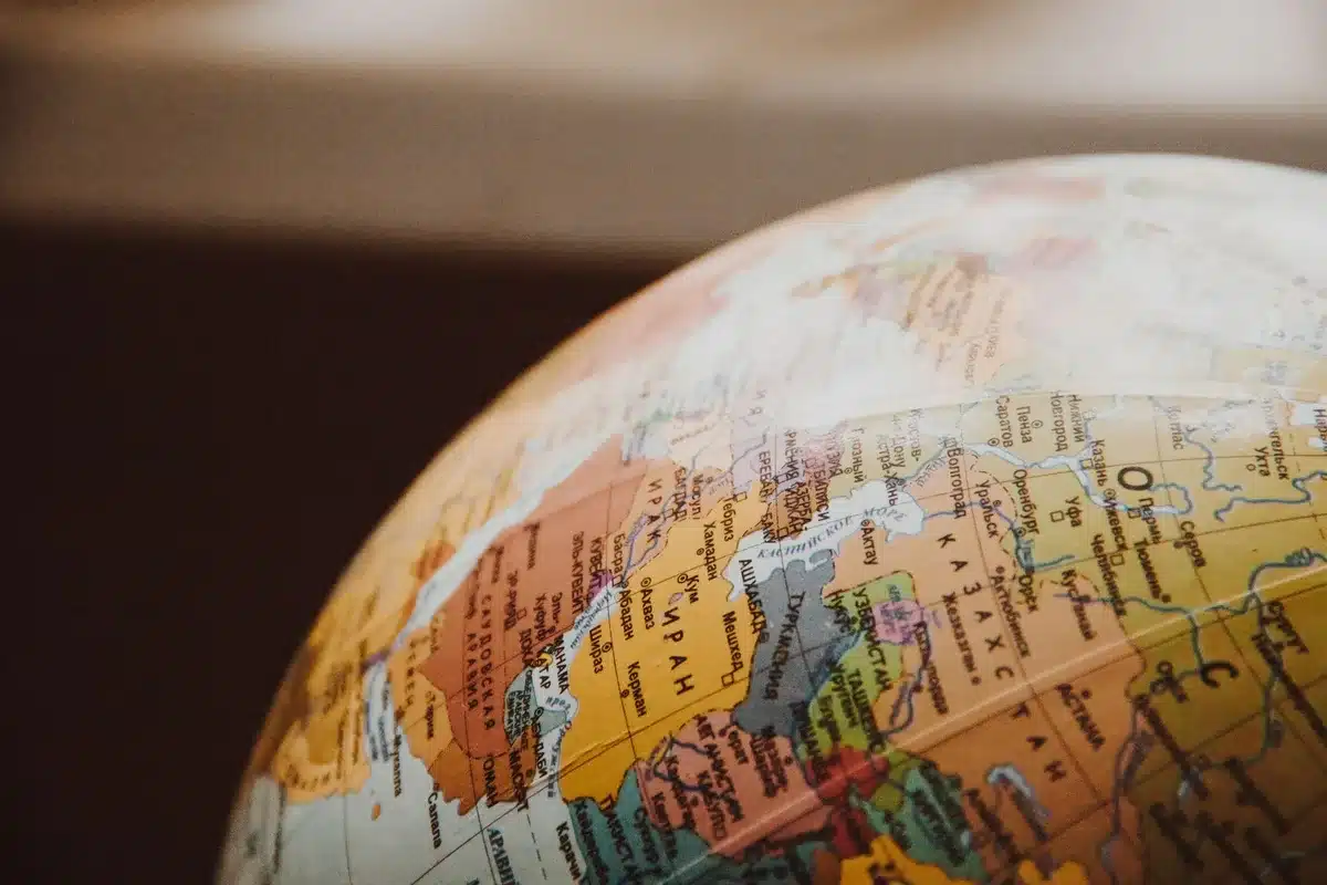 A global map with delivery brand logos and market coverage zones highlighted across Asia, Europe, Middle East, Latin America, and Africa, representing worldwide expansion.