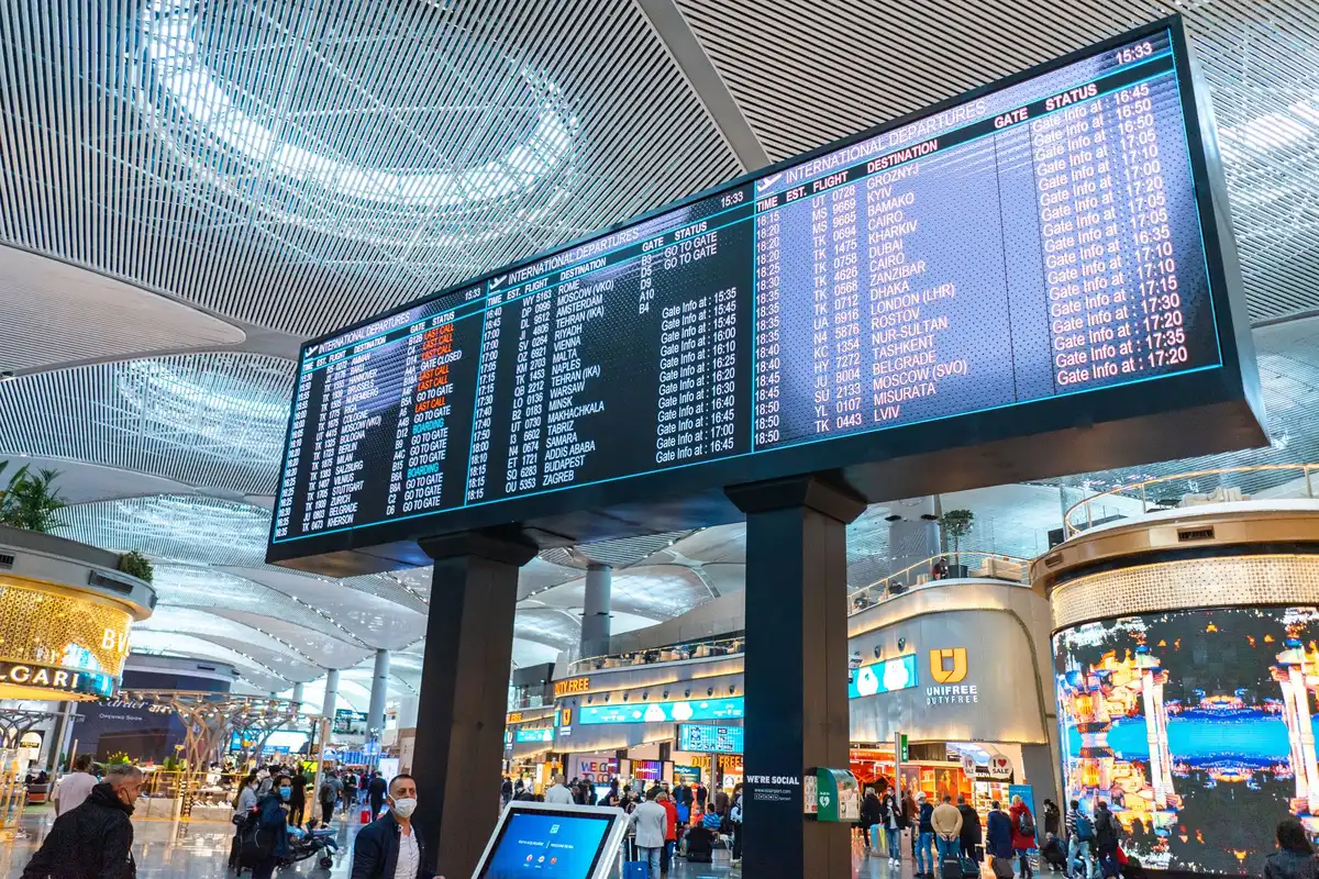 A close-up of a computer screen displaying a flight schedule or bidding system interface, with rows of flight information and trip details visible, representing the digital tools flight attendants use to bid and trade trips.