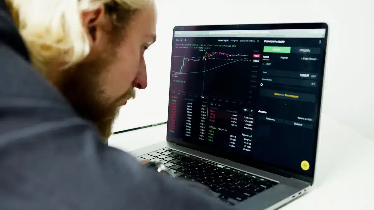 Earnings report displayed on a financial trading screen, red and green candlestick charts visible, stock ticker symbols glowing, no text readable