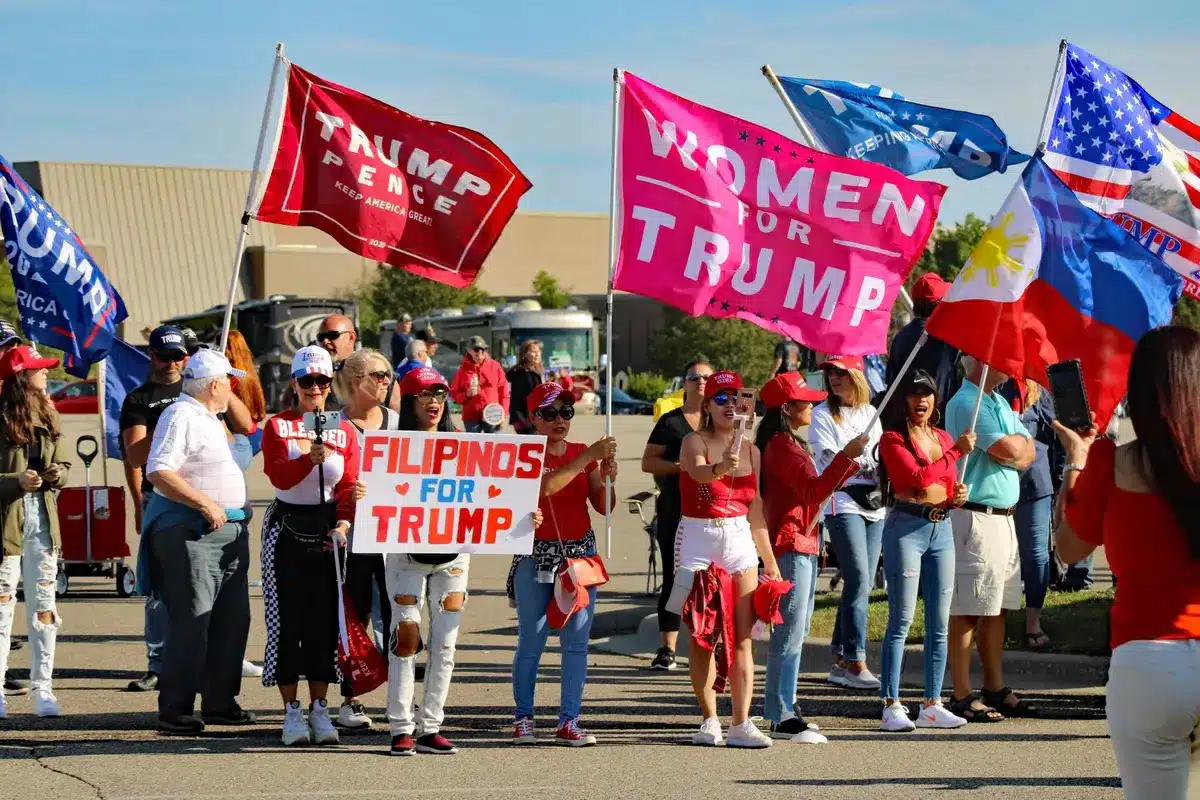 A split-screen frame showing a crowded campaign rally on one side with energized supporters, and an empty debate stage on the other side, representing the volatile primary landscape.