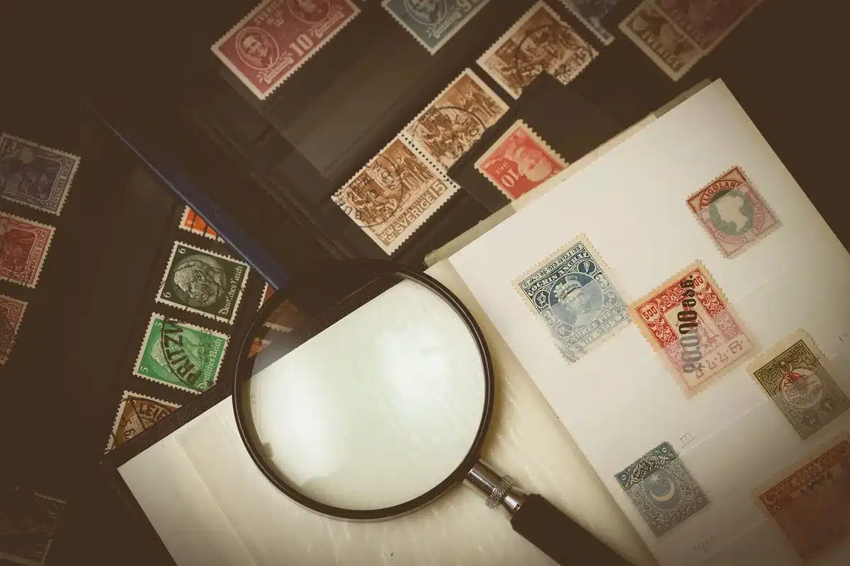 A stack of official documents with red "APPROVED" stamps, papers slightly fanned to show depth, a pen resting on top, soft focus background of a desk with filing folders, conveying bureaucratic processing and administrative clearance.