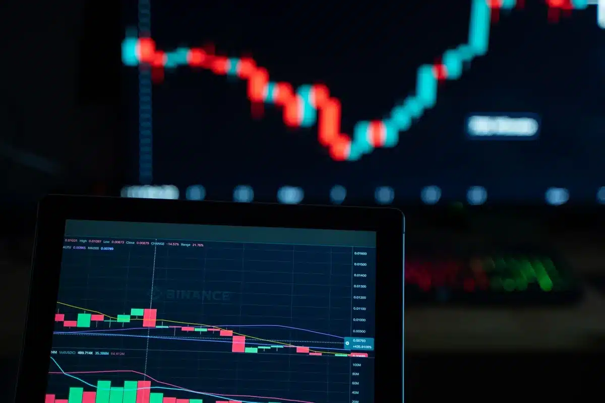 A split screen showing a stock chart with an upward trajectory on the left side, and a data visualization of cloud computing networks glowing in the right side, representing market confidence and cloud growth