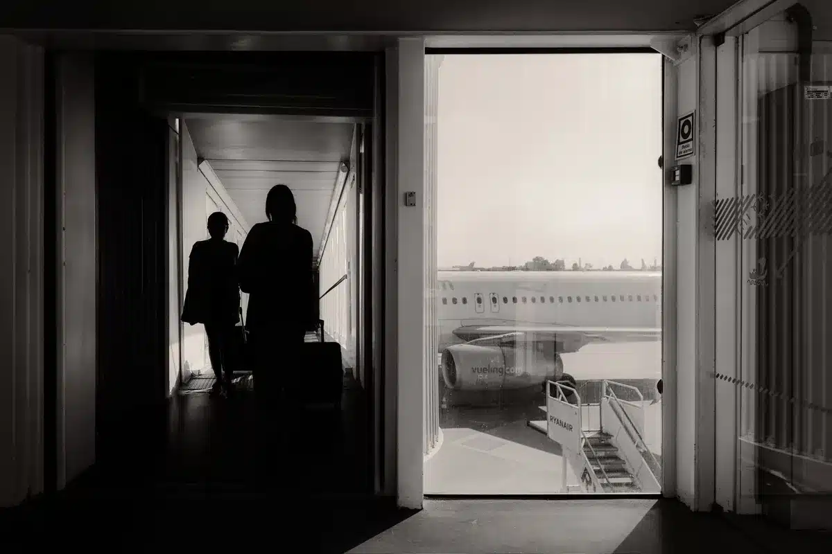 Empty airport gate with boarding pass on seat, dim lighting, sense of abandonment