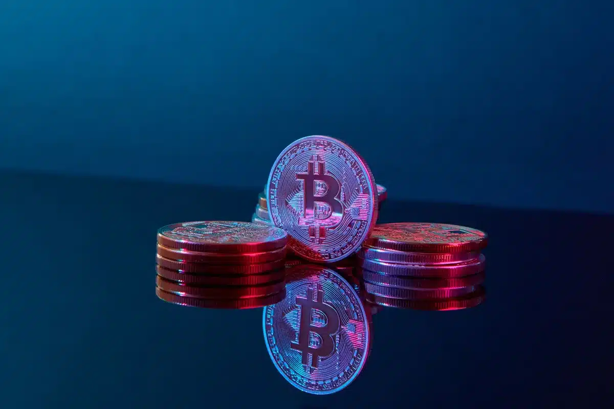 A split-screen visualization showing Bitcoin's August historical performance on the left (red downward bars for 2022-2025) and a calendar with August highlighted in red on the right, symbolizing the seasonal weakness ahead.