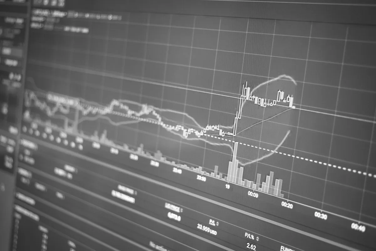 A Treasury trading floor with screens displaying rising yield curves in red, anonymous traders monitoring market data, tension visible in body language, overhead lighting casting sharp shadows across workstations