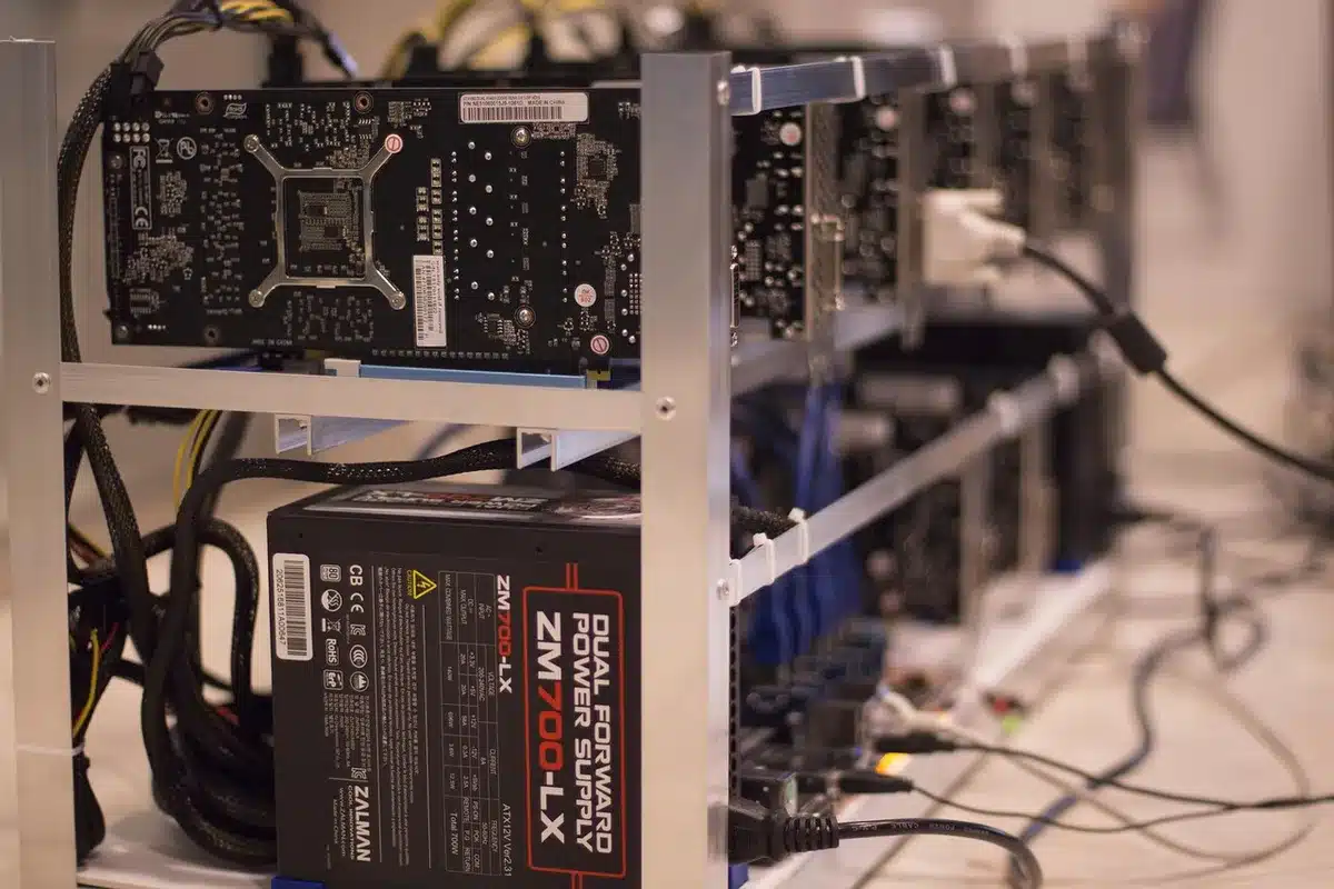 Stacks of physical Bitcoin coins arranged on a dark surface, catching light to emphasize their value, representing the millions recovered from a defunct exchange.