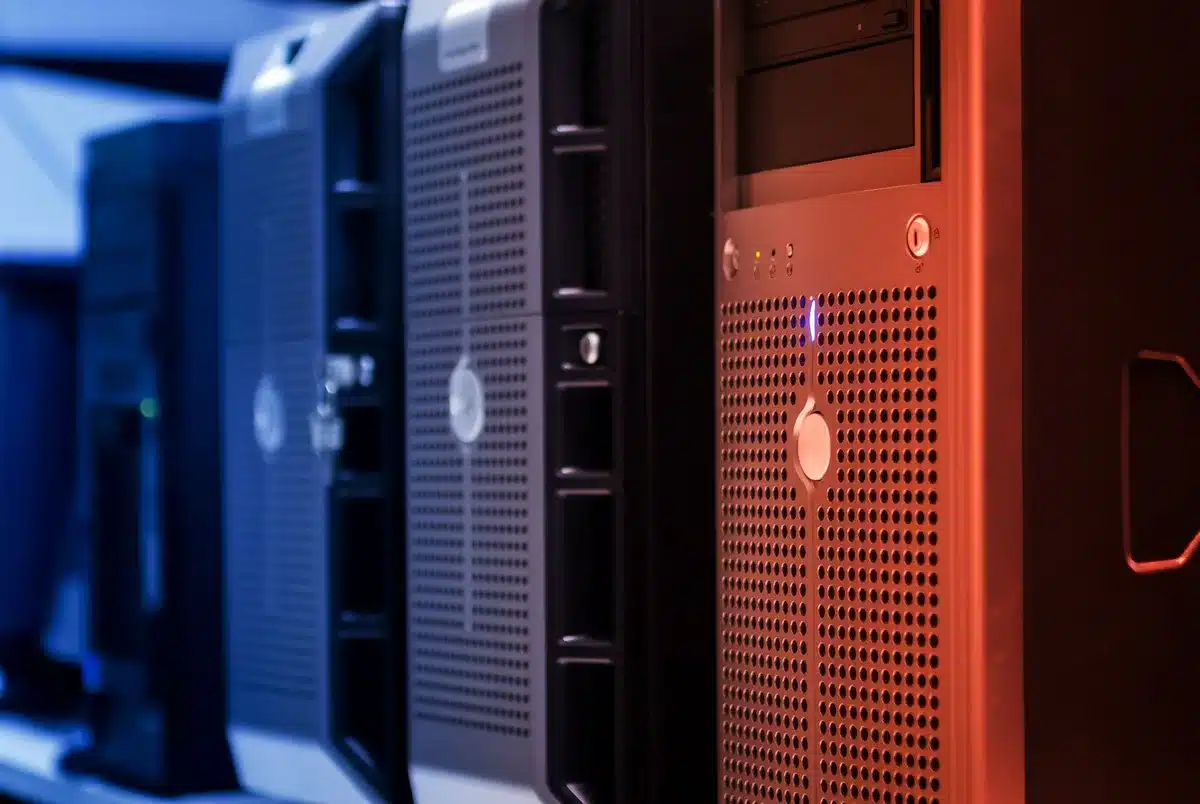 Data center server racks with glowing indicator lights and cooling systems