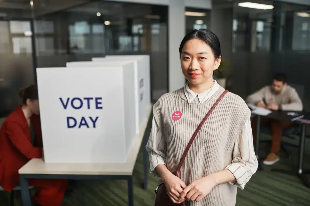 Anonymous voter casting ballot in a polling booth, focused expression, soft natural light