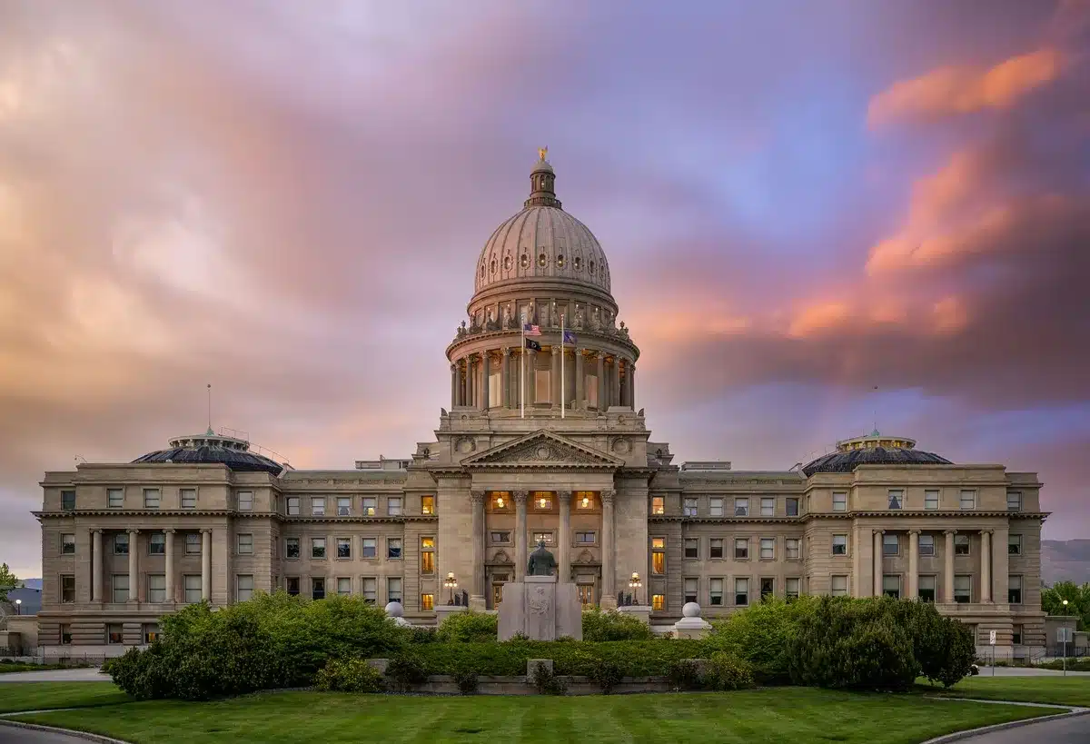 U.S. Capitol building exterior, formal marble steps and columns, neutral daylight, empty plaza
