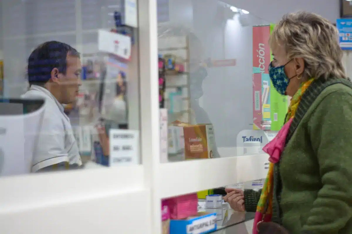 A warehouse retail environment with seniors browsing health and wellness products, natural lighting emphasizing accessibility