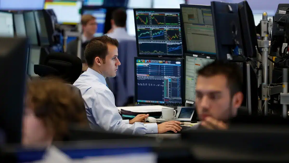 Stock market data displayed on screens with upward trending lines | financial data visualization