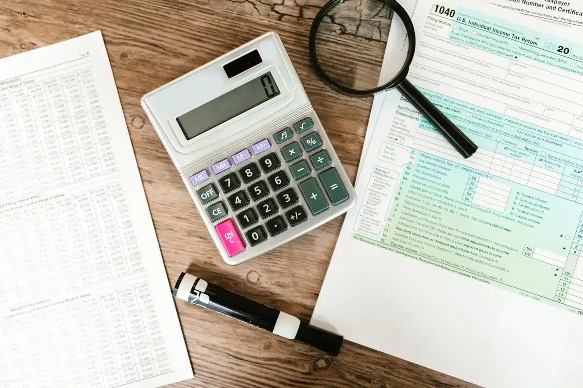 Person reviewing retirement account statements showing Roth vs traditional comparison