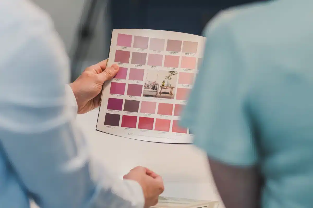 Three distinct interior color palettes displayed side-by-side showing coordinating paint colors and textures, with Deep Rooted as the anchor hue in each scheme