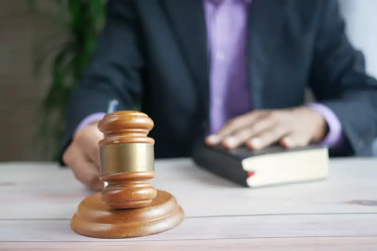 A judge's gavel resting on a desk with case files, symbolizing the ongoing legal proceedings and custody battle