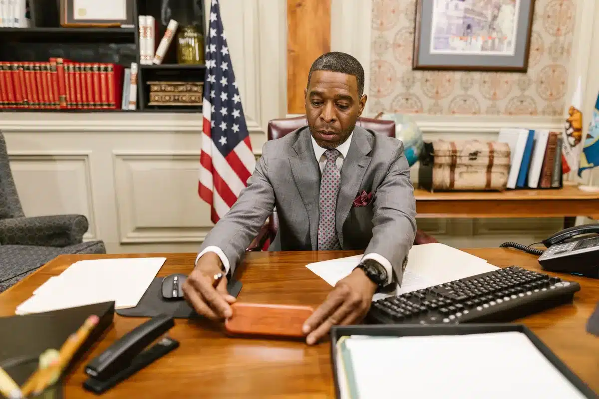 An empty congressional office desk with a nameplate, symbolizing political accountability and the weight of character questions in elected office.
