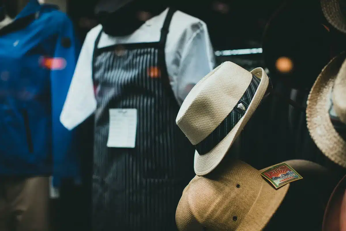 A retail storefront window displaying Father's Day merchandise with family-oriented imagery and lifestyle photography rather than product-focused displays, modern boutique setting