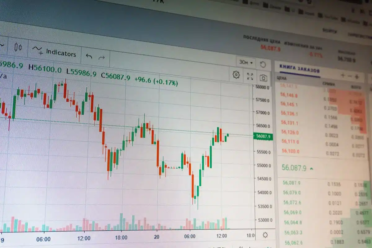 A split-screen comparison of a falling Bitcoin price chart on one side and rising Treasury yield indicators on the other, symbolizing the competition between Bitcoin and traditional risk-free assets.