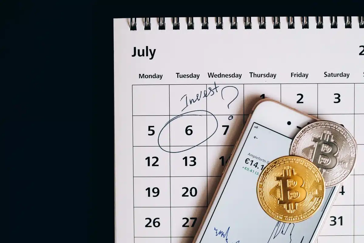 Economic calendar on a trading screen with color-coded event importance levels, real-time data updating, and multiple currency pairs tracked