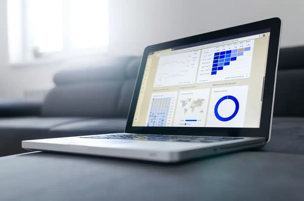 Financial performance dashboard showing declining revenue trends alongside rising subscription percentages, with charts and metrics displayed on a modern monitor screen