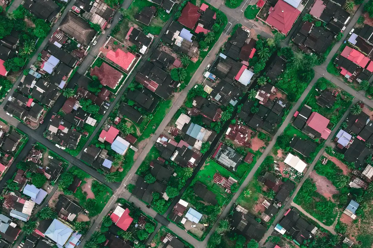 A close-up of a satellite image showing a real geographic landmark with subtle digital artifacts overlaid, demonstrating how AI-generated elements blend with authentic imagery
