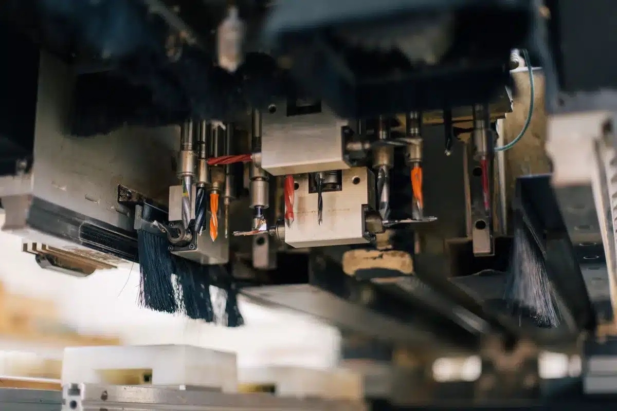 Modern semiconductor fabrication facility interior with rows of advanced equipment under bright overhead lighting, clean room aesthetic