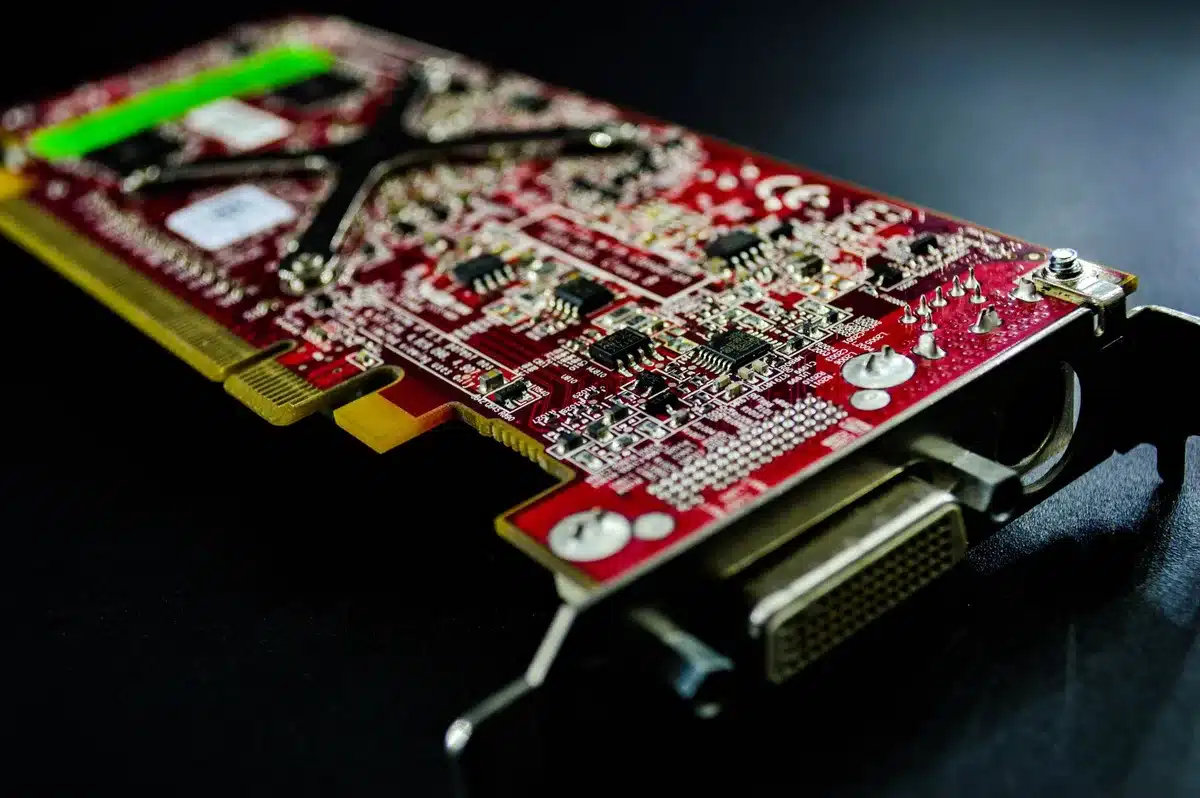 A close-up of advanced GPU chips with intricate circuit patterns and heat dissipation elements under studio lighting, symbolizing cutting-edge semiconductor innovation.