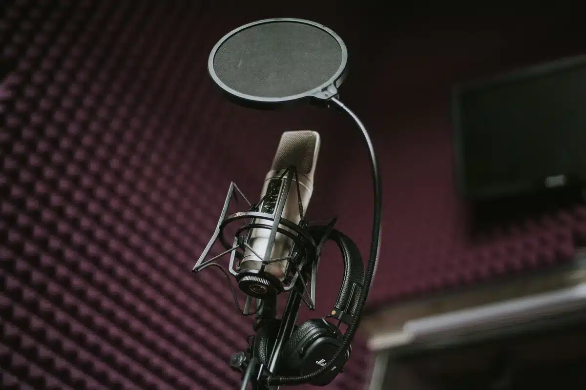 Podcast studio microphone setup under studio lighting
